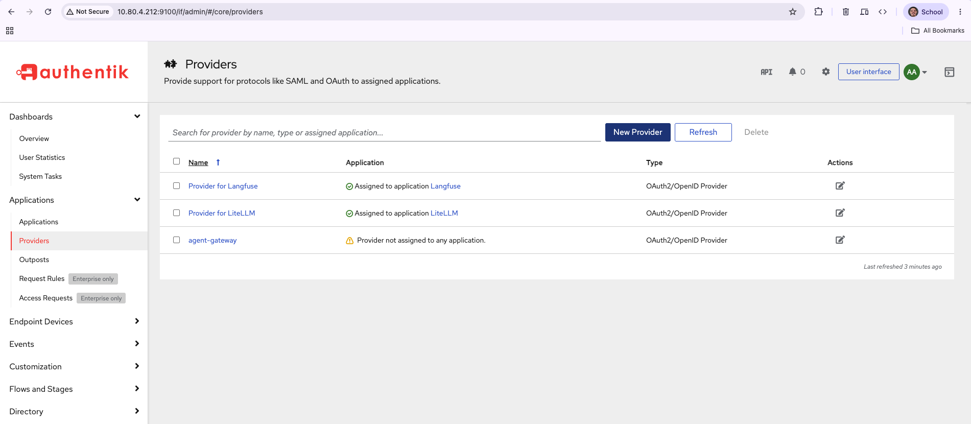 The authentik Providers list showing agent-gateway with a warning reading Provider not assigned to any application, beside two healthy providers assigned to Langfuse and LiteLLM