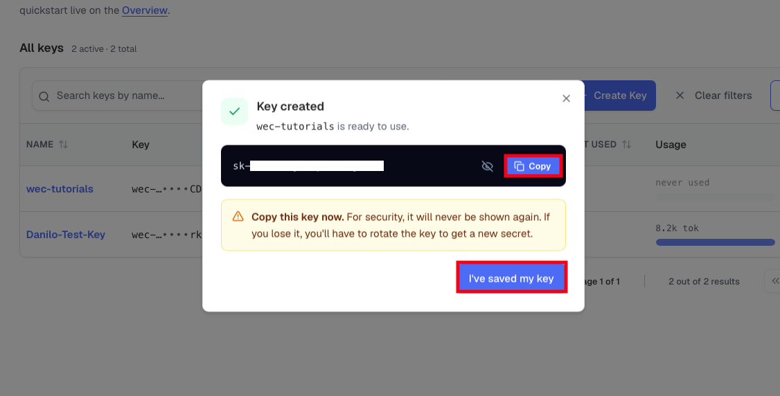 The Key created dialog showing the secret with a Copy button and a one-time warning